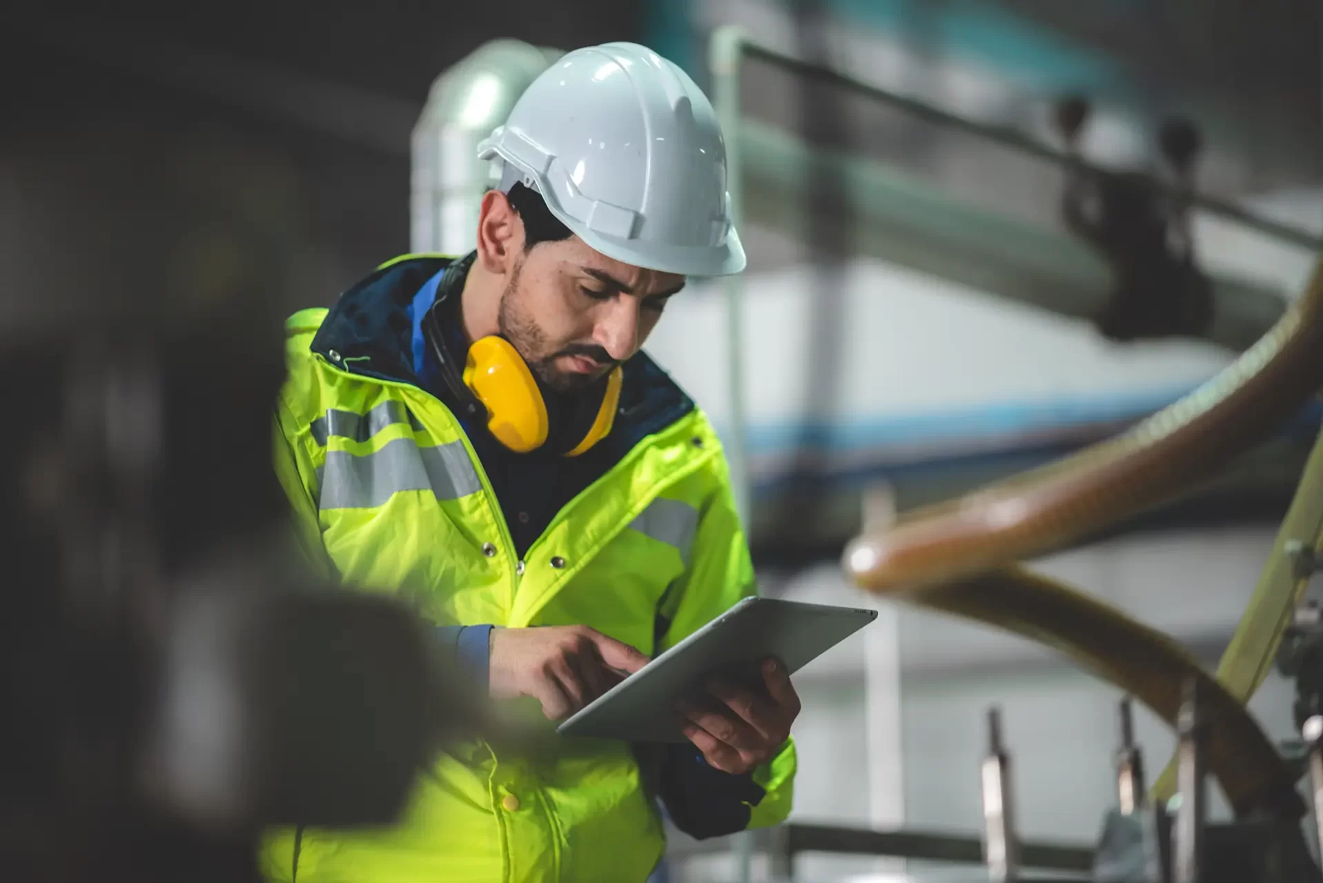 A safety employee looking at a clipboard